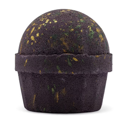 Mörk badbomb med guldfärgade och gröna detaljer