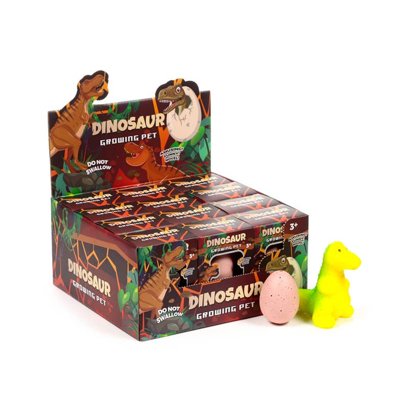 Kläckande ägg med dinosaurie