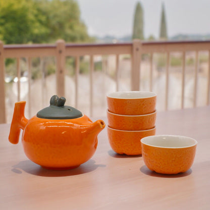 Teservis i orange keramik – tekanna och 4 koppar